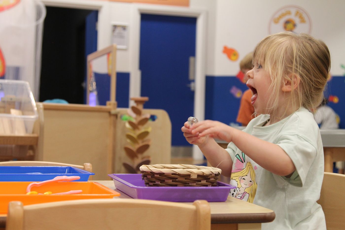 Child laughing during messy sensory play